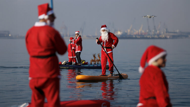 Santa Goes Paddleboarding in Greece for the Holidays